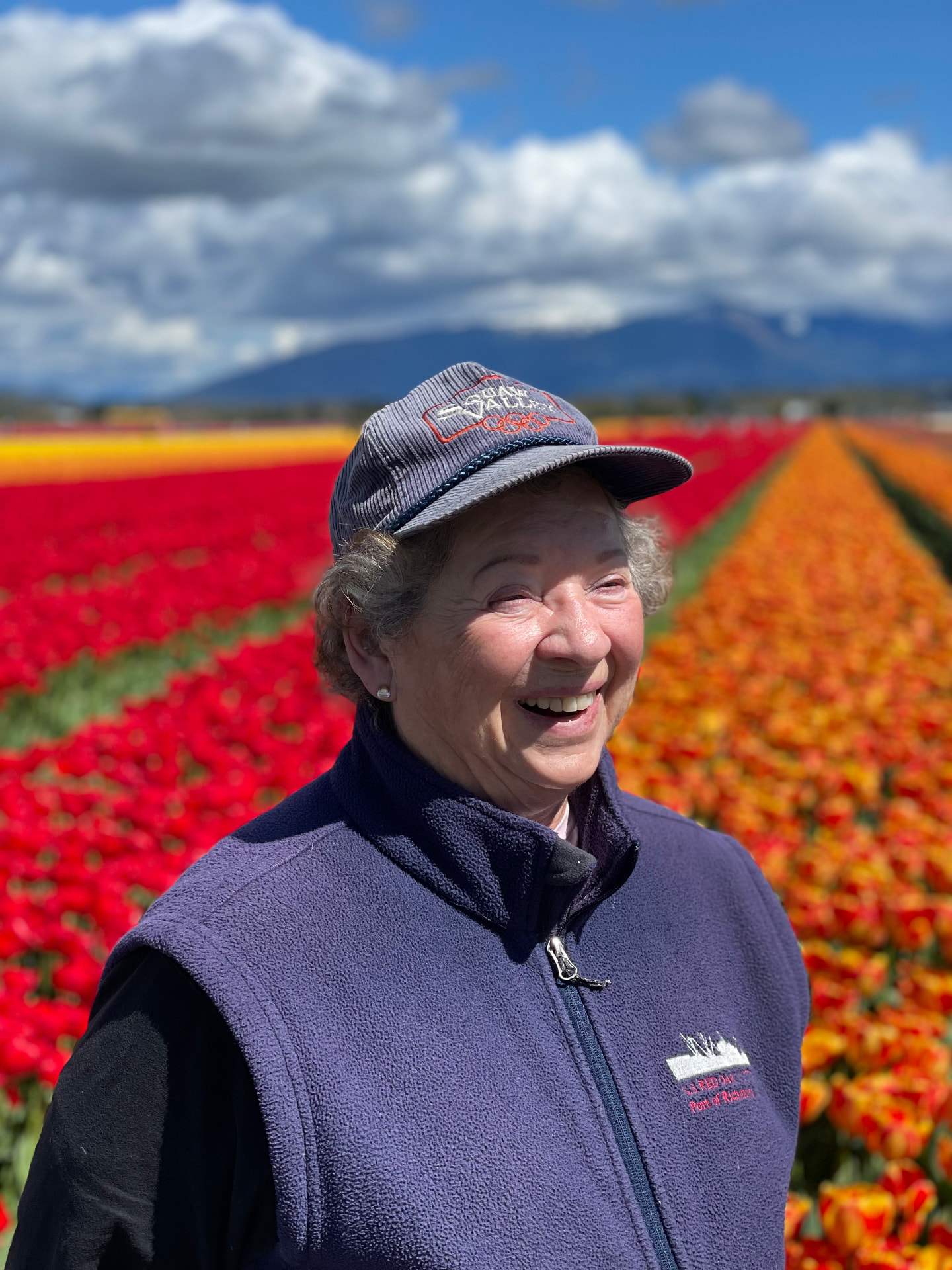 Martha Ann smiling in a field of tulips